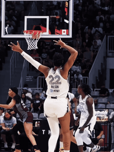 A Female Basketball Player With The Number 22 On The Back Of Her Jersey GIF