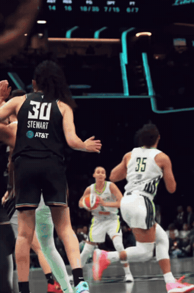 A Female Basketball Player With The Number 30 On Her Jersey GIF