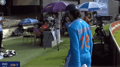 A Female Cricket Player Wearing A Number 18 Jersey GIF