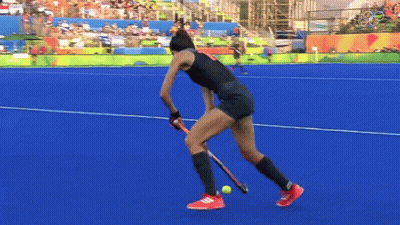 A Female Field Hockey Player With The Number 9 On Her Shorts GIF