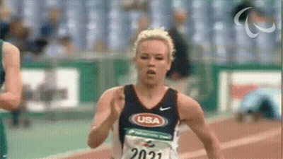A Female Runner Wearing A Usa Shirt Is Running GIF