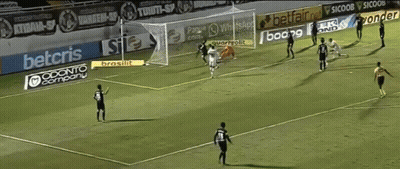 A Female Soccer Player Takes Off Her Shirt In Front Of A Vito Sign GIF