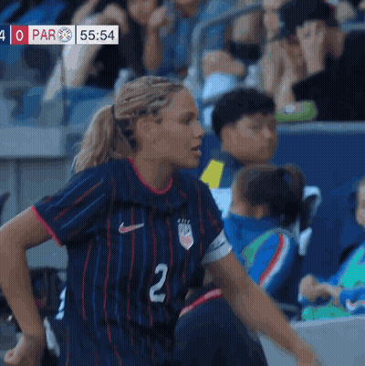A Female Soccer Player Wearing A Blue Jersey With The Number 2 On It GIF
