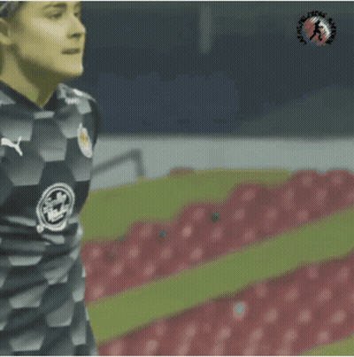 A Female Soccer Player Wearing A Jersey That Says Coca Cola On It GIF