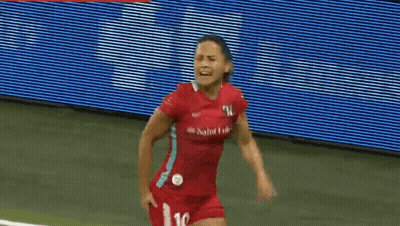 A Female Soccer Player Wearing A Red Jersey With The Number 16 On It GIF