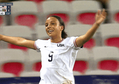 A Female Soccer Player Wearing A White Usa Jersey GIF