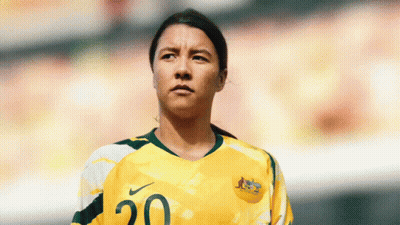 A Female Soccer Player Wearing A Yellow And Green Jersey With The Number 20 On It GIF