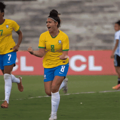 A Female Soccer Player Wearing A Yellow Shirt With The Number 8 On It GIF