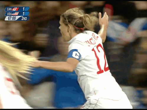 A Female Soccer Player With The Number 12 On Her Back GIF