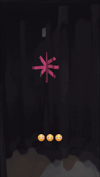 A Female Wrestler In A Pink And Black Outfit Is Holding A Barbie Doll GIF