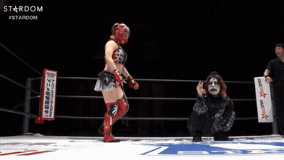 A Female Wrestler In A Ring With A Sign That Says Stardom GIF