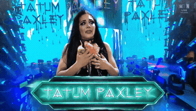 A Female Wrestler Named Tatum Paxley Holds A Cupcake GIF