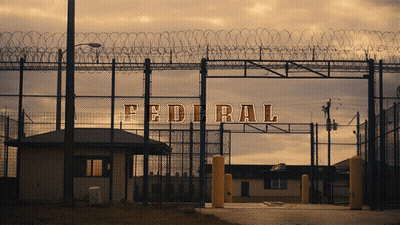 A Fence With Barbed Wire And The Word Federal Written On It GIF