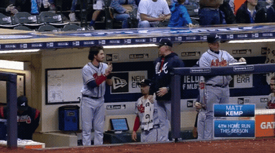 A Few Baseball Players Standing In A Dugout With A Sign That Says Matt Kemp GIF