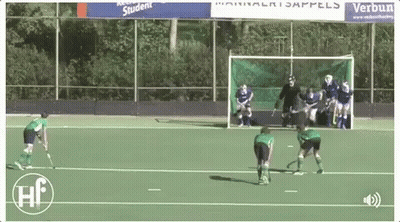 A Field Hockey Game Is Being Played In Front Of A Banner That Says Verbun Student GIF