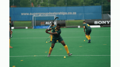 A Field Hockey Game Is Being Played In Front Of A Sony Ad GIF