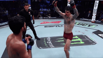 A Fighter In A Boxing Ring With A Monster Energy Can In The Background GIF