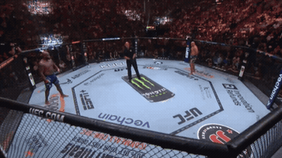 A Fighter In A Ufc Ring With A Monster Energy Drink On The Floor GIF