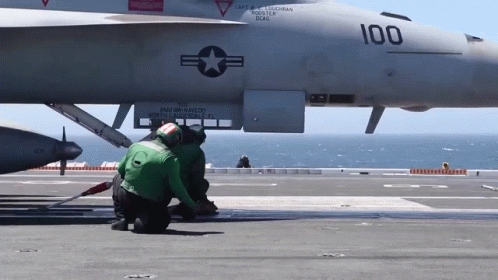 A Fighter Jet With The Number 100 On It GIF