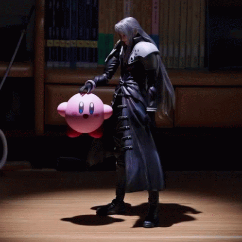 A Figure Of A Man Holding A Pink Kirby Toy GIF