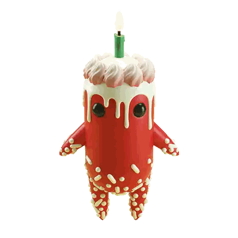A Figurine Of A Birthday Cake With A Green Candle On Top Sticker