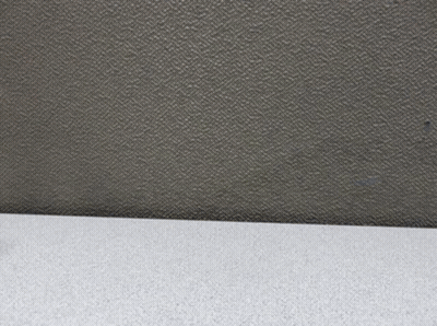 A Figurine Of A Man In A Suit And Hat Is Standing On A Table GIF