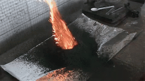 A Fire Is Coming Out Of A Piece Of Tin Foil GIF