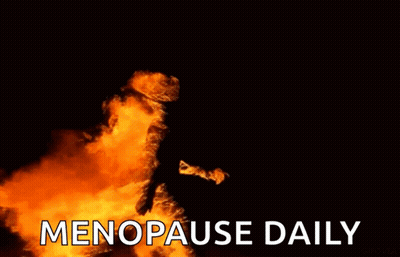 A Fire With The Words `` Menopause Daily '' Written In White Letters On A Black Background . GIF