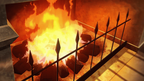 A Fireplace With A Fence Surrounding It And A Fire Burning GIF