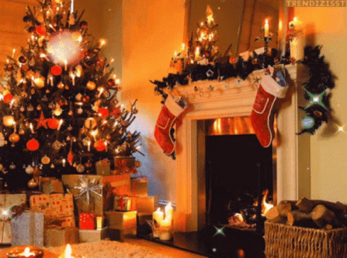 A Fireplace With Christmas Stockings Hanging From It GIF
