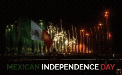 A Fireworks Display For Mexican Independence Day With A Flag In The Background GIF