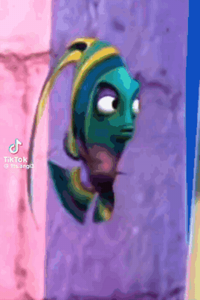 a fish from the movie finding dory is hanging on a wall .