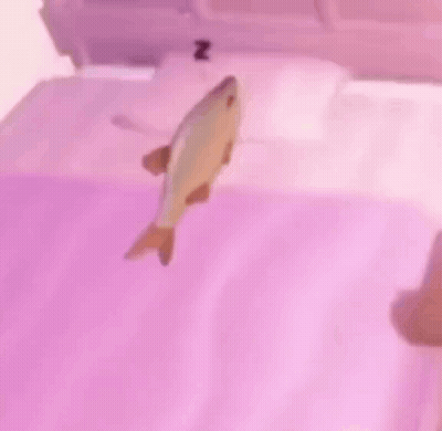 A Fish Is Floating On Top Of A Bed With A Purple Blanket . GIF
