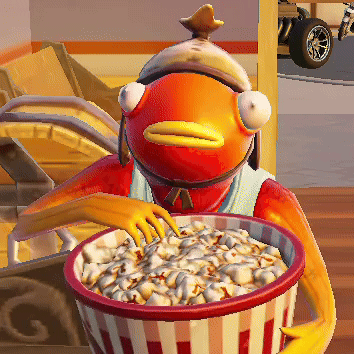 A Fish Is Holding A Bowl Of Popcorn In His Hand GIF