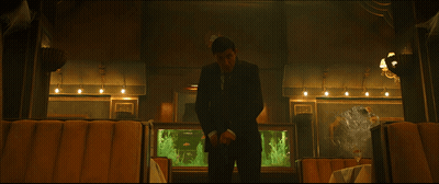 A Fish Tank In A Restaurant With A Sign On The Wall That Says ' Fish ' On It GIF
