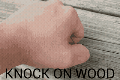 A Fist Is Shown With The Words Knock On Wood Above It GIF