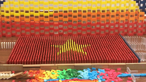 A Flag Made Out Of Dominoes With A Yellow Star GIF