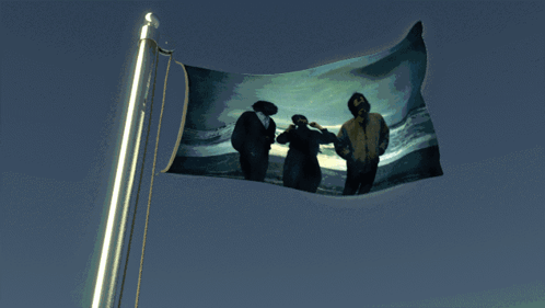 A Flag With A Picture Of Three People On It Is Waving In The Wind GIF