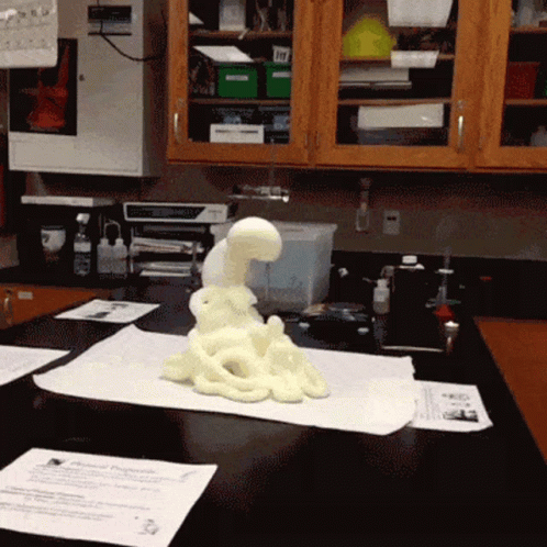 A Foam Sculpture Is Sitting On A Table In A Science Lab GIF