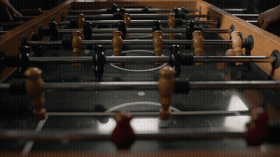 A Foosball Table Has A Circle In The Middle Of It GIF