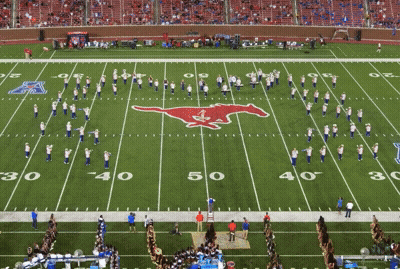 A Football Field With A Mustang Logo On The Field GIF