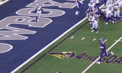 A Football Field With The Word Cowboy On The Side GIF