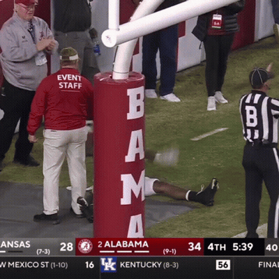 A Football Game Between Alabama And Kentucky Is Being Shown On A Television Screen GIF