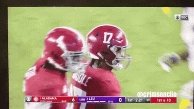 A Football Game Between Alabama And Lsu Is Being Shown On Television GIF