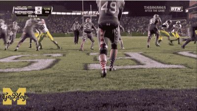 A Football Game Between Michigan And Northwest GIF