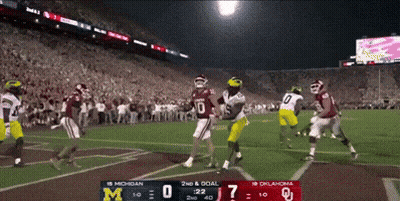 A Football Game Between Michigan And Oklahoma Is Being Played GIF