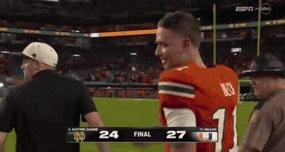 A Football Game Between Notre Dame And Miami Is Being Broadcast On Espn GIF