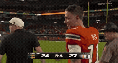 A Football Game Between Notre Dame And Miami Is On Espn GIF