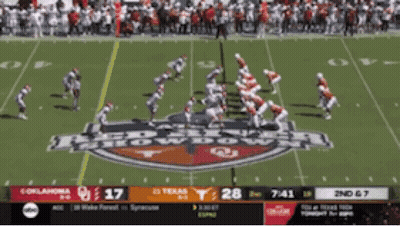 A Football Game Between Oklahoma And Texas Is Being Played GIF