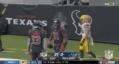 A Football Game Between Texas And Green Bay GIF